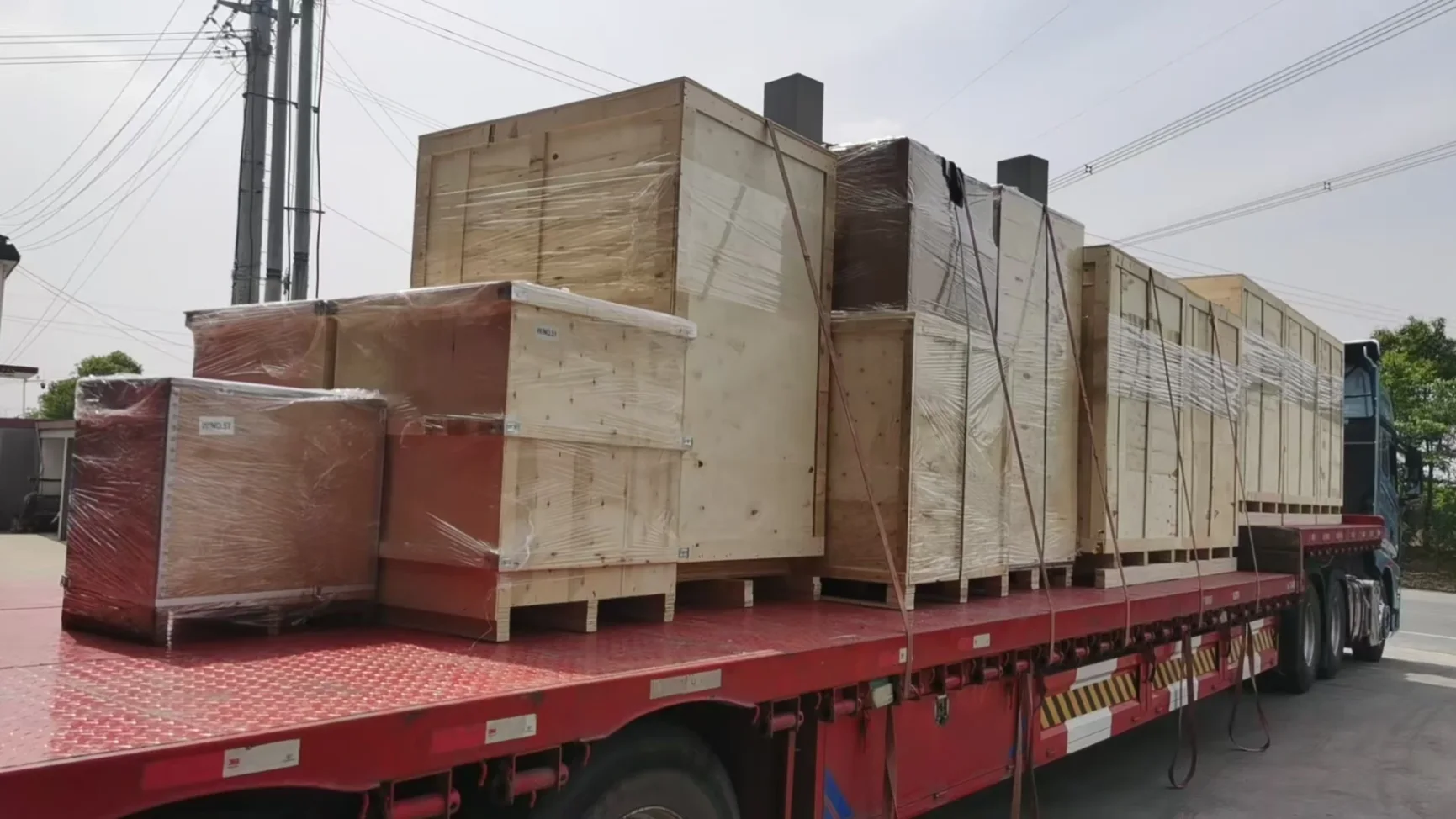 Packaged liquid-cooled load bank units loaded on truck for transport to seaport